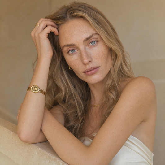 Opéra Watch Gold on model wrist, lifestyle portrait with ivory satin dress