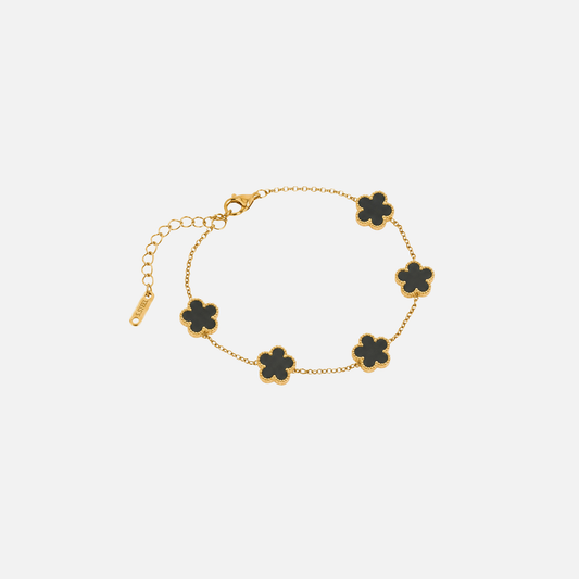 Trèfle Bracelet Gold & Onyx by Vaurie Paris, gold tone chain bracelet with black five-leaf clover charms