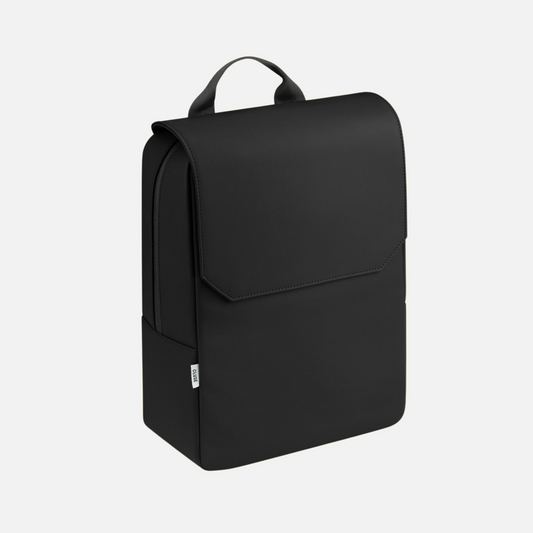 Backpack Black by Vaurie Paris, angled front view of minimalist black backpack with flap and top handle