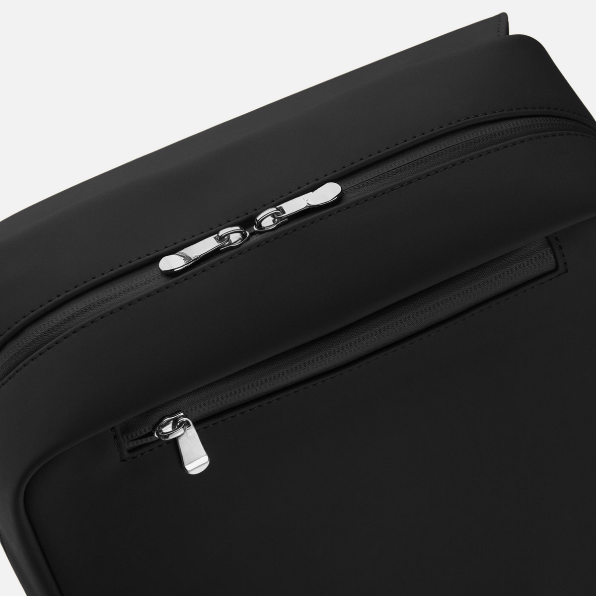 Backpack Black close-up of silver tone zippers and front zip pocket