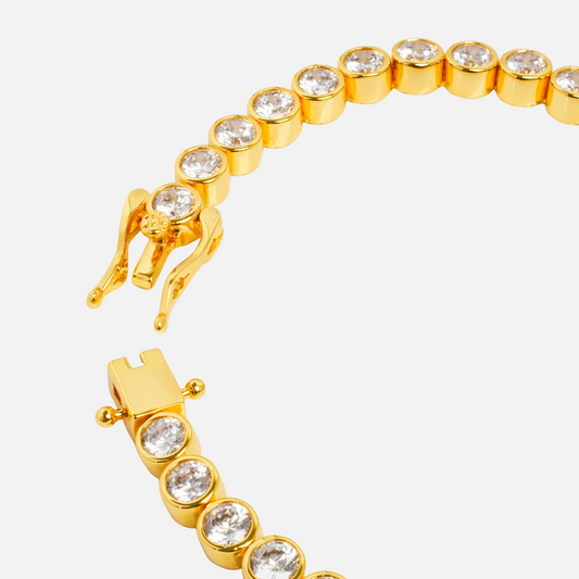 Cassiopeia Tennis Bracelet close-up of gold tone clasp and bezel-set clear stones