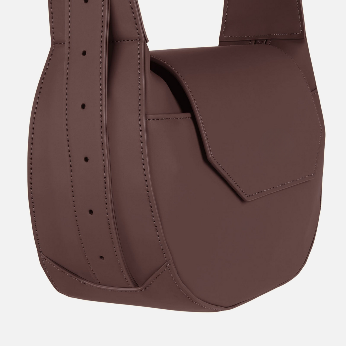 Crossbody Bag Dark Brown close-up of the angular flap and perforated strap detail