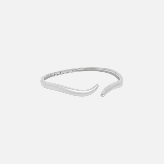 Sea Bracelet by Vaurie Paris, silver tone wave-shaped open cuff bracelet on a white background